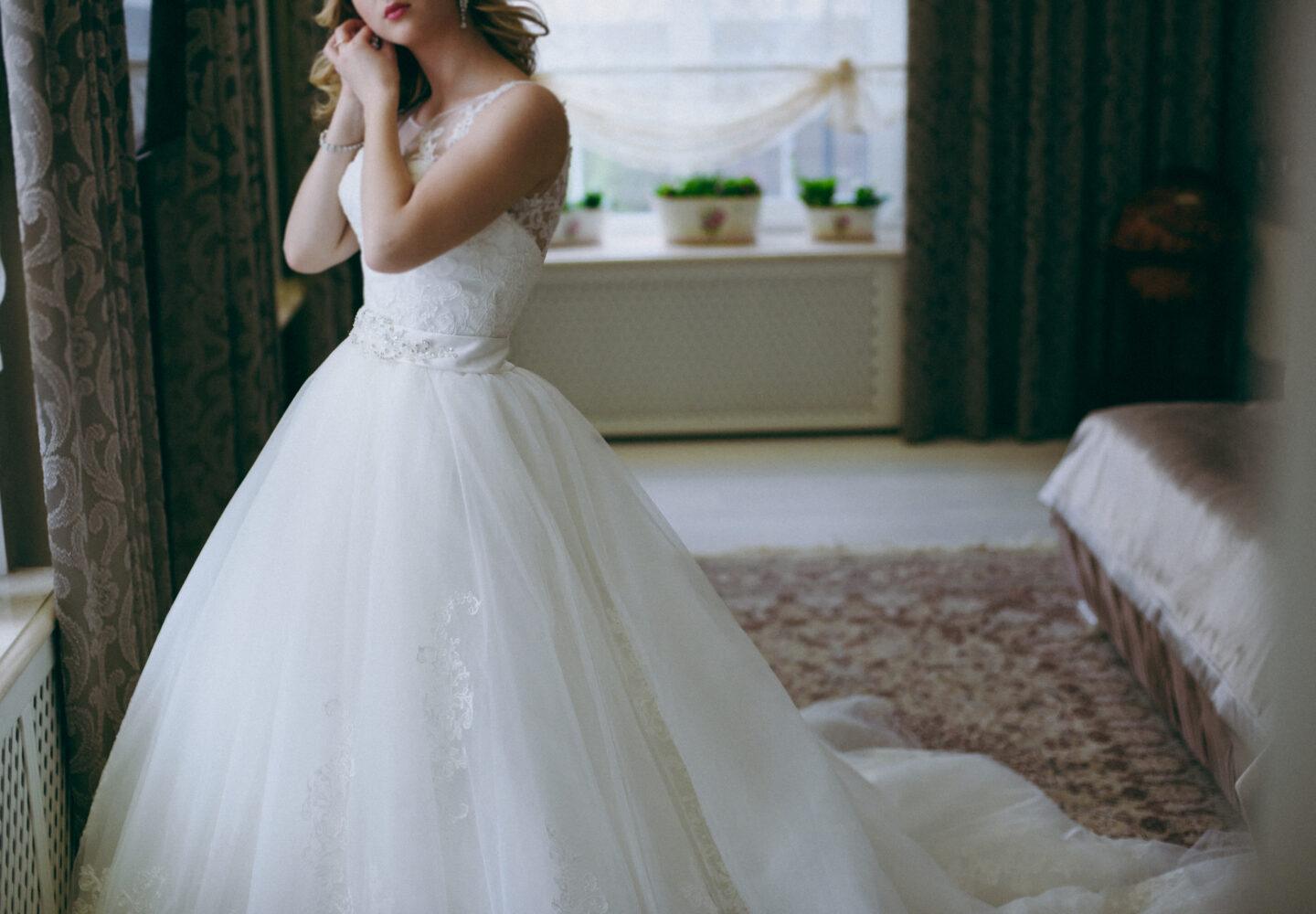 Bride,Puts,On,Earrings | | | band, ring, look |Madison Jean Jewelers