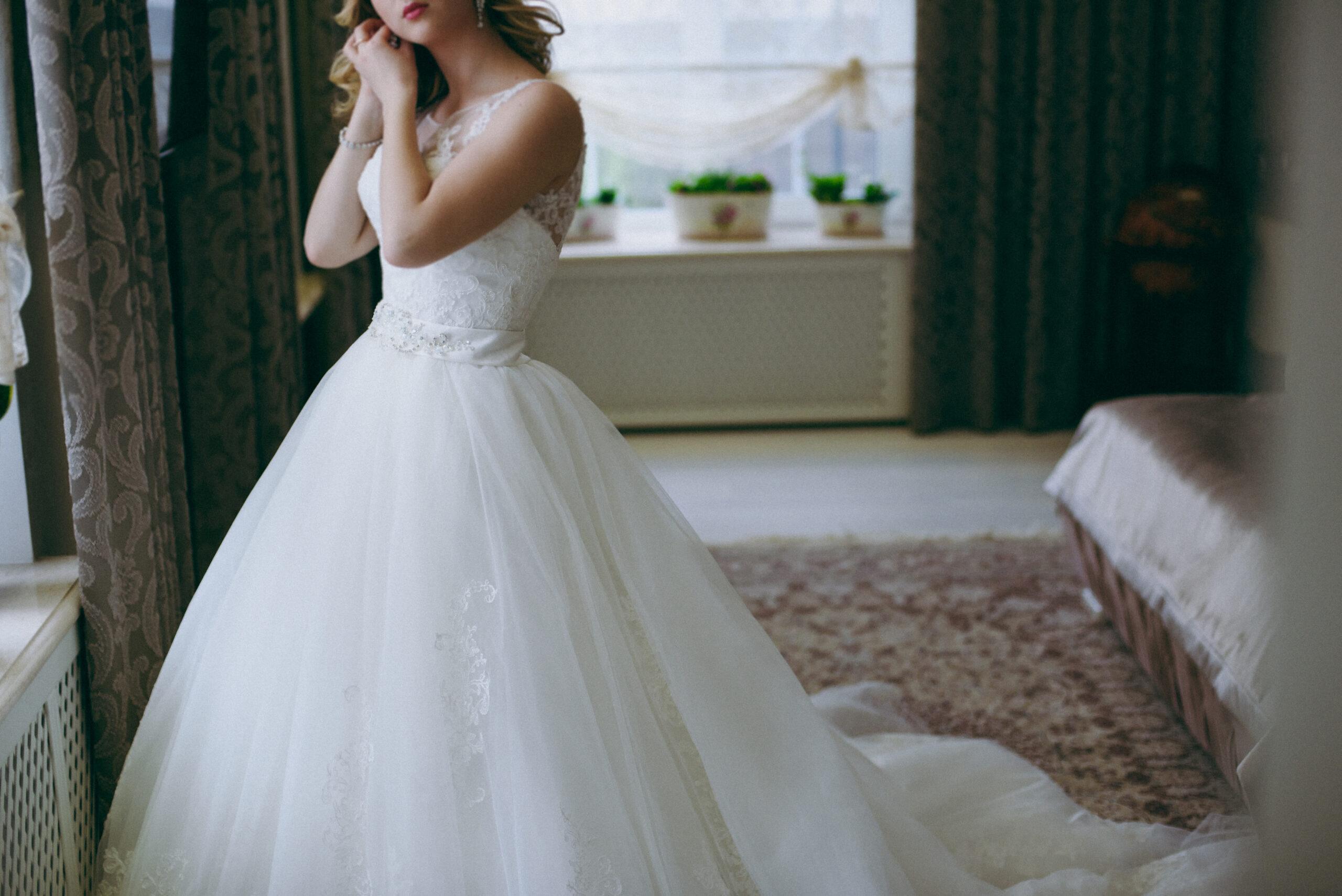 Bride,Puts,On,Earrings | | | band, ring, look |Madison Jean Jewelers